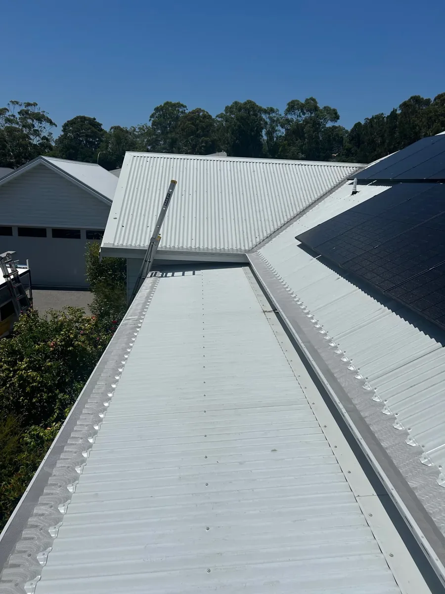 Premium aluminium gutter guard fitted along a corrugated metal roof in Kangaroo Valley
