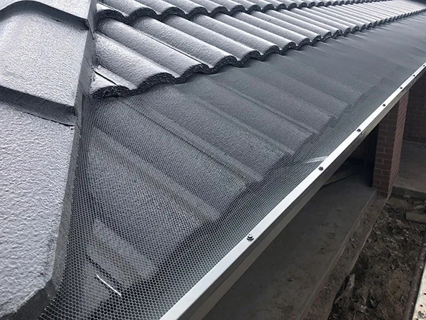 Premium aluminium gutter guard mesh fitted to a terracotta tile roof